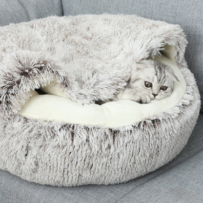 Comfortable donut pet bed for cats & small dogs, providing a warm, cozy, and secure sleeping spot.