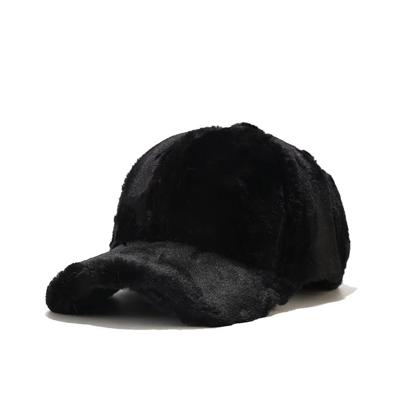 Stylish women's faux fur cap, cozy plush accessory for cold winter fashion.