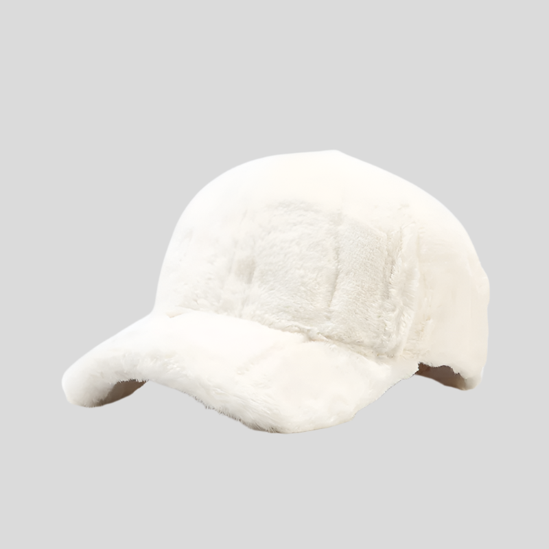 Warm women's faux fur cap, stylish plush accessory perfect for winter fashion trends.
