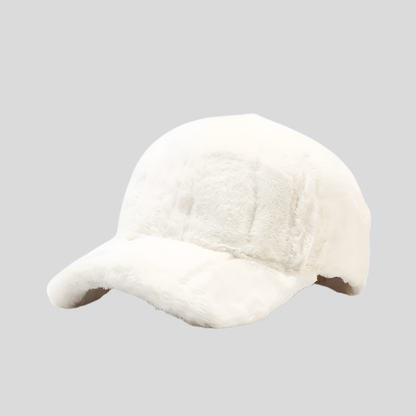 Warm women's faux fur cap, stylish plush accessory perfect for winter fashion trends.