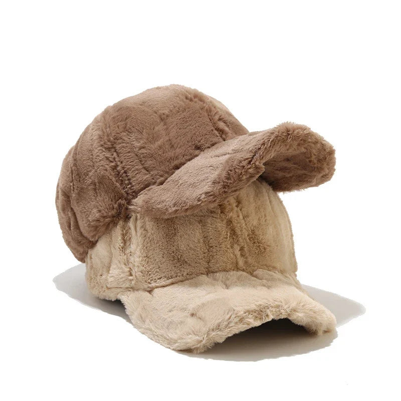 Cozy women's plush faux fur cap, a fashionable winter hat accessory.