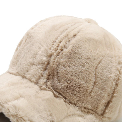 Luxurious plush faux fur cap, women's soft and warm winter headwear accessory.