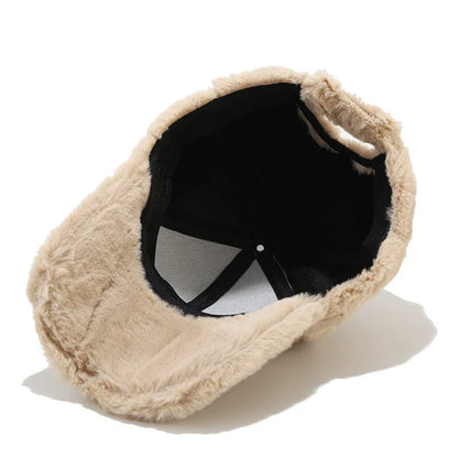 Chic women's faux fur cap, plush and warm for a cozy winter style statement.