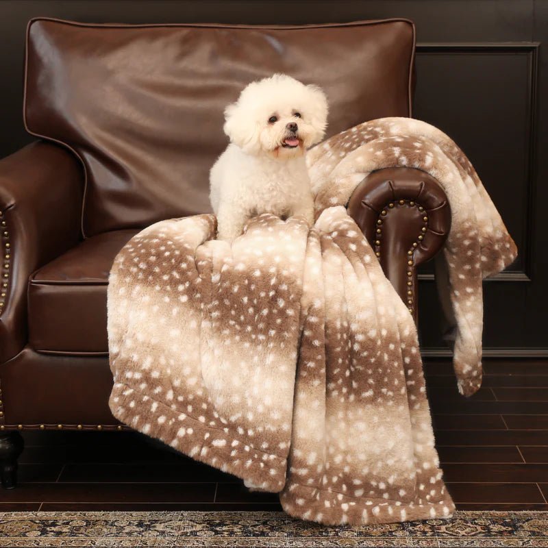 Super soft plush faux fur blanket with charming deer print. A luxurious, warm accent throw for any home decor style.