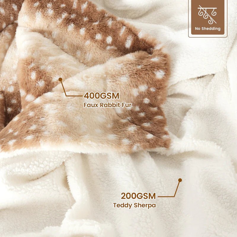Comforting faux fur deer blanket, reversible & plush. Enhances bedroom or living room as stylish, warm home decor.