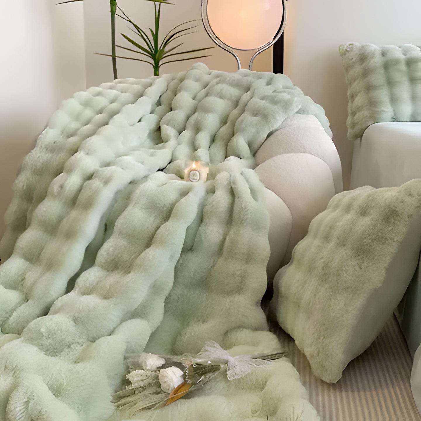 Elegant faux fur throw blanket, a cozy housewarming gift, adds luxury & warmth to living room or bedroom.