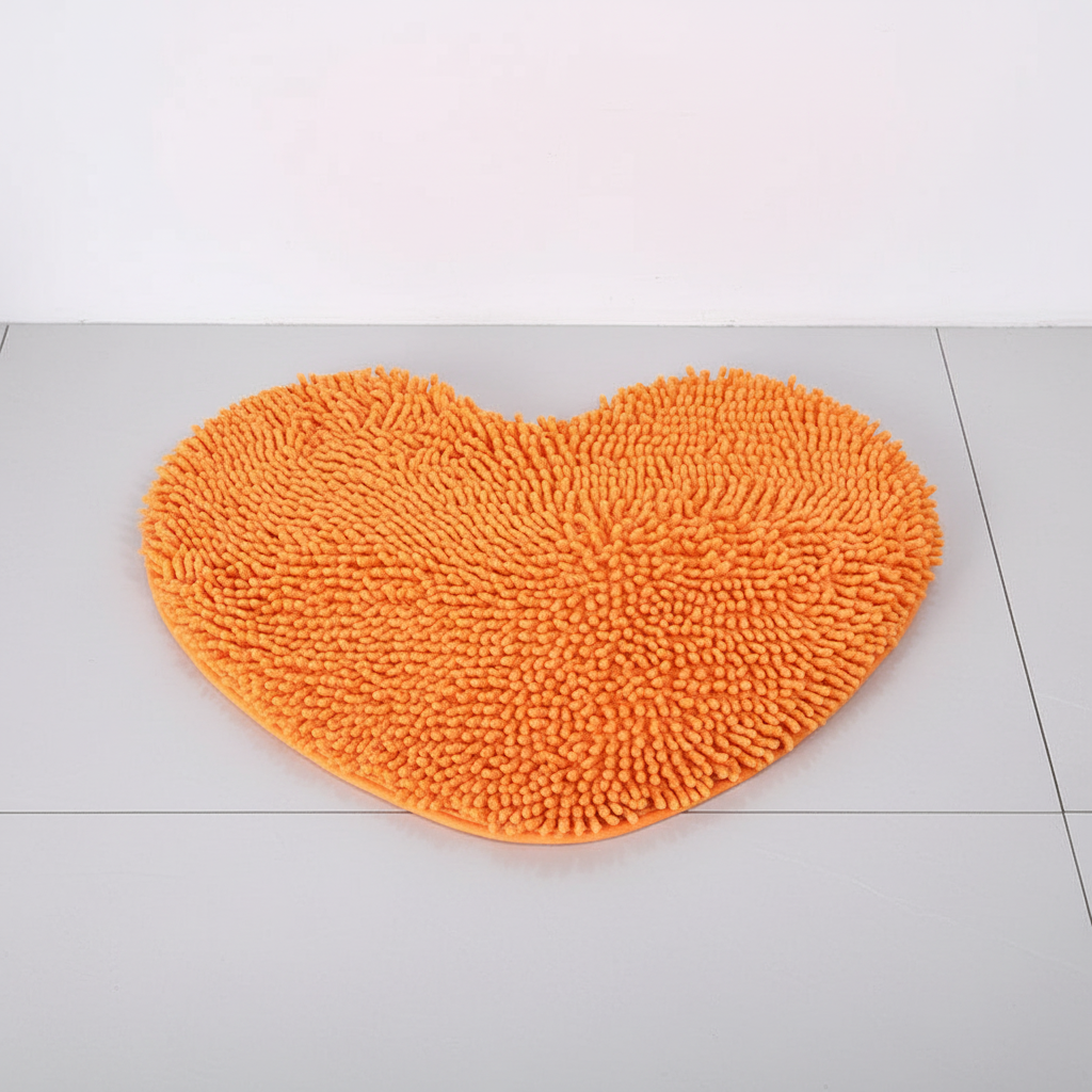 Pink plush heart bath mat. Soft chenille microfiber, absorbent, non-slip. Cute bathroom decor accent.