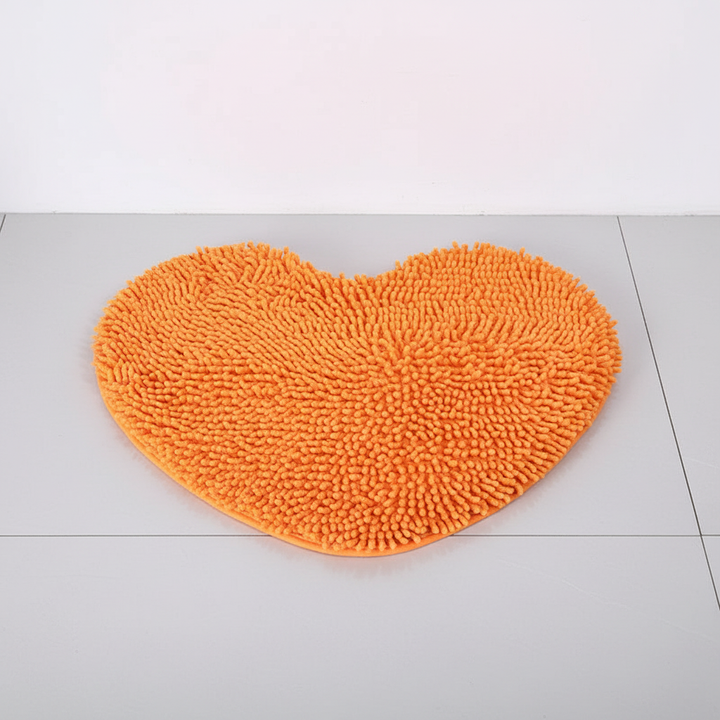 Pink plush heart bath mat. Soft chenille microfiber, absorbent, non-slip. Cute bathroom decor accent.