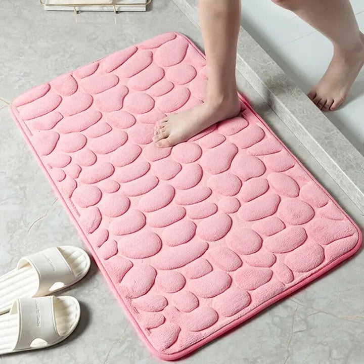 Plush memory foam non-slip home mat with elegant embossed velvet design for comfort and safety.