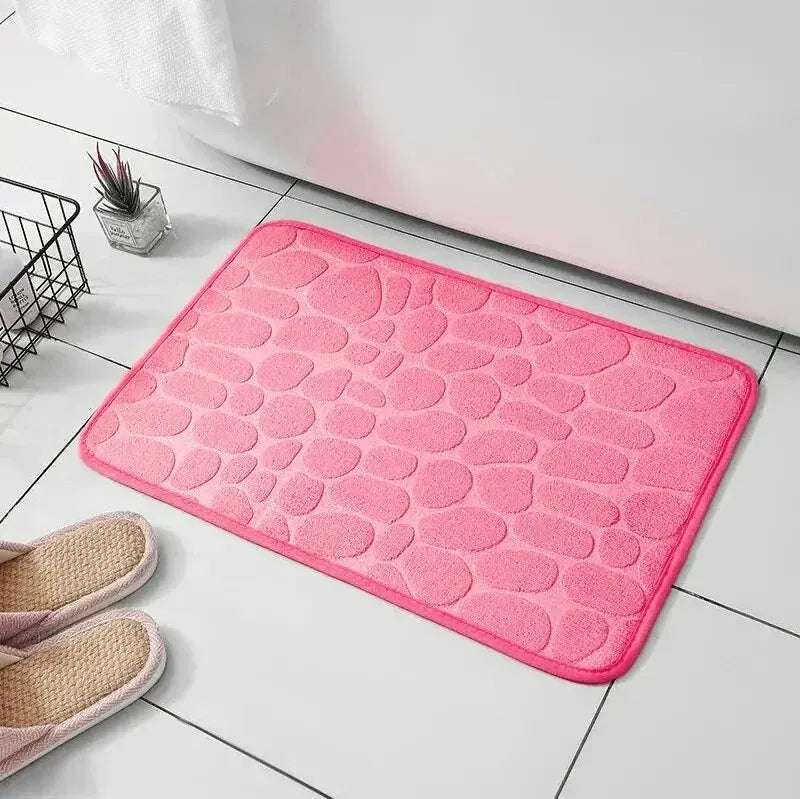 Detailed view of the intricate embossed pattern on a soft velvet memory foam comfort mat.