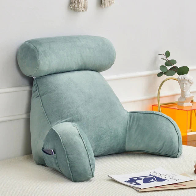 Plush reading pillow, an essential home decor item for cozy relaxation in bed.