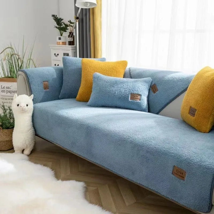 Stylish plush sofa cover for modern home decor. Soft polyester living room furniture cover for cozy comfort.