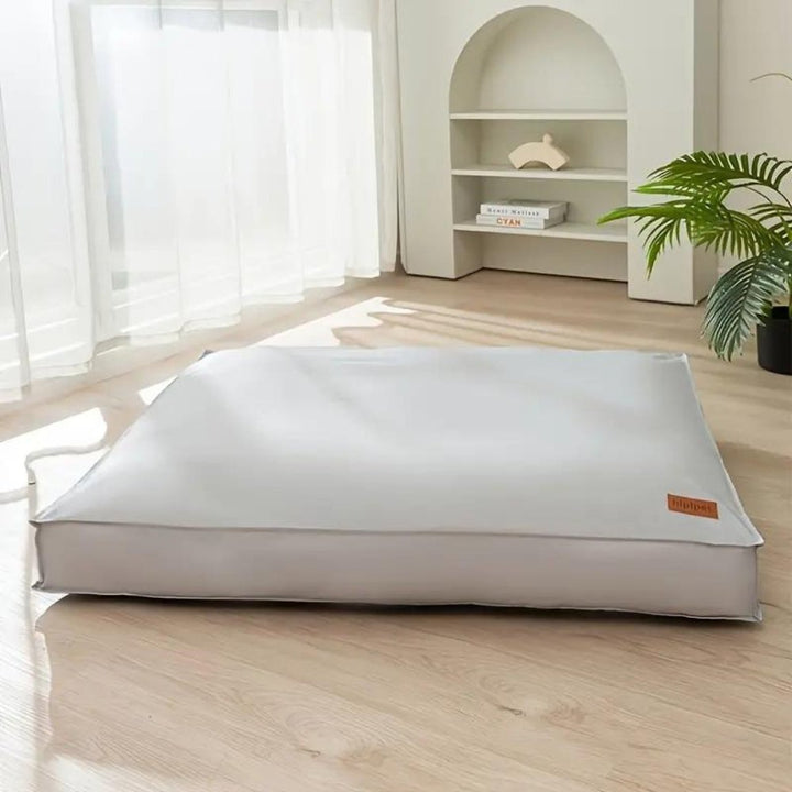 Versatile waterproof dog bed, comfortable for indoor or outdoor use, washable and non-slip for all size dogs.