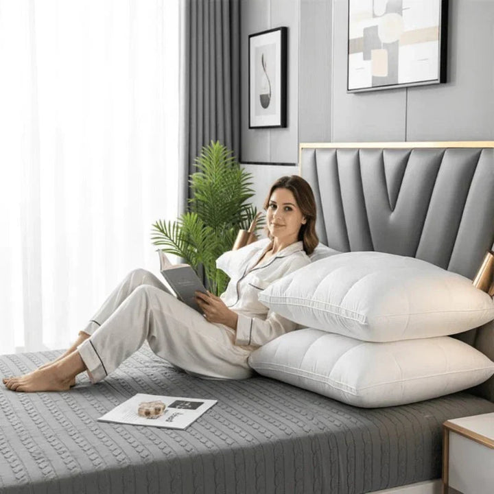 Plush white feather blend bedroom pillow offering balanced support for restful sleep and neck comfort.