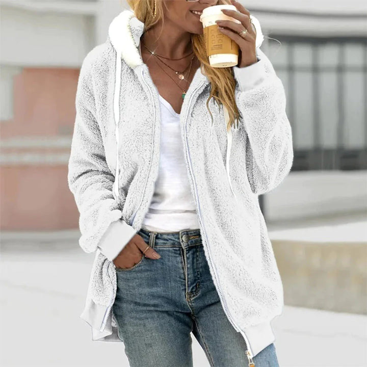 Stylish women's zip-up hoodie, perfect for layering in autumn & winter fashion. Cozy and comfortable.