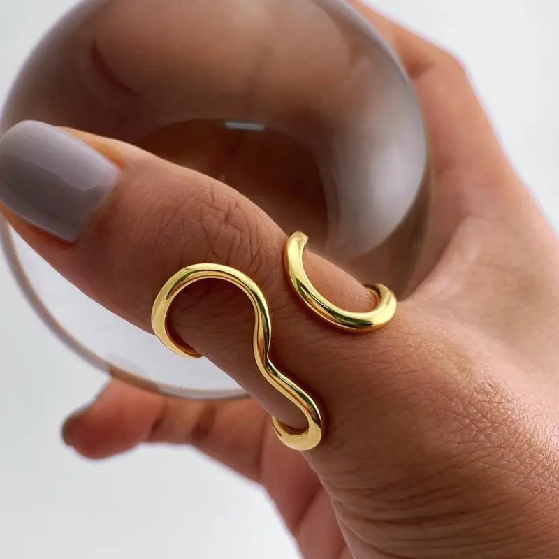 Polished gold women's infinity wrap ring, adjustable and tarnish-free. A stylish, hypoallergenic accessory.