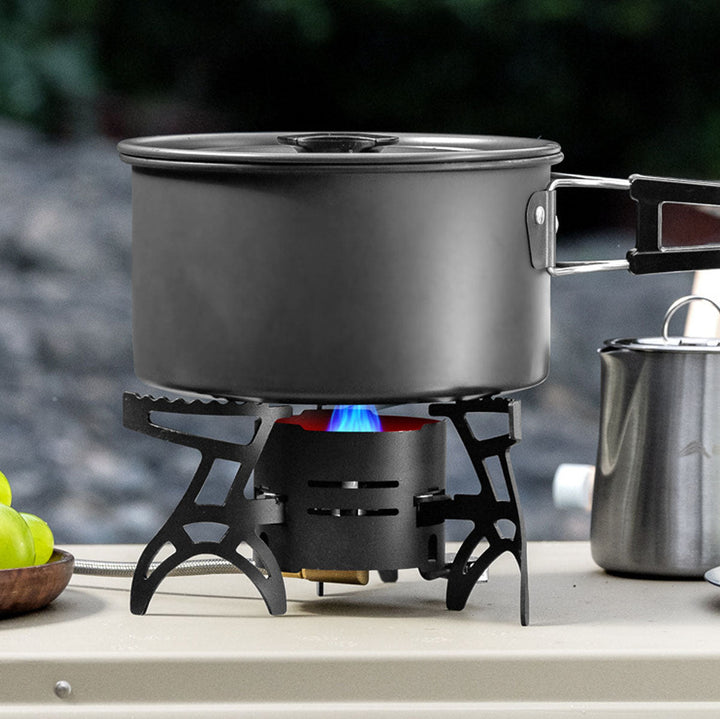Image demonstrating the compact size of the portable gas camping stove next to a standard water bottle.
