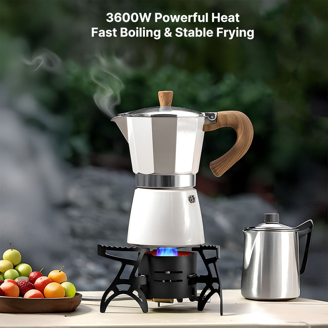 Portable gas stove set up outdoors, with a pot on top, showcasing its stability for camping cooking.