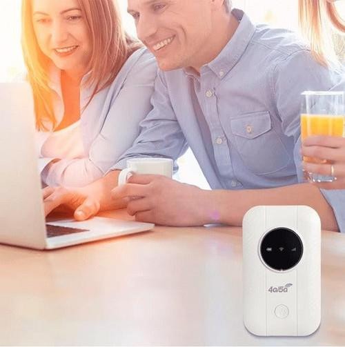 Black portable 5G WiFi router, small and powerful, offers wireless internet for adventures.