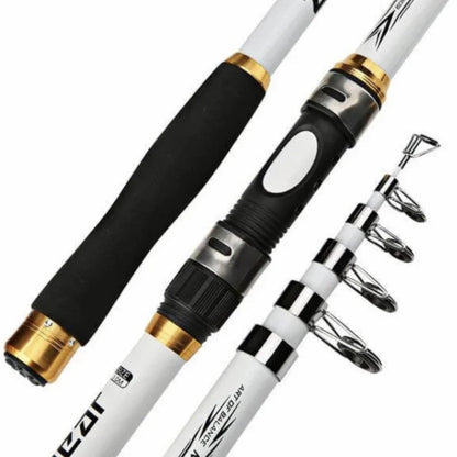 Angler holding a lightweight carbon fiber telescopic fishing rod by a lake, enjoying outdoor sports.