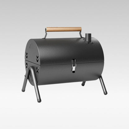 Portable charcoal grill, ideal for camping and outdoor cooking, folded for easy travel.