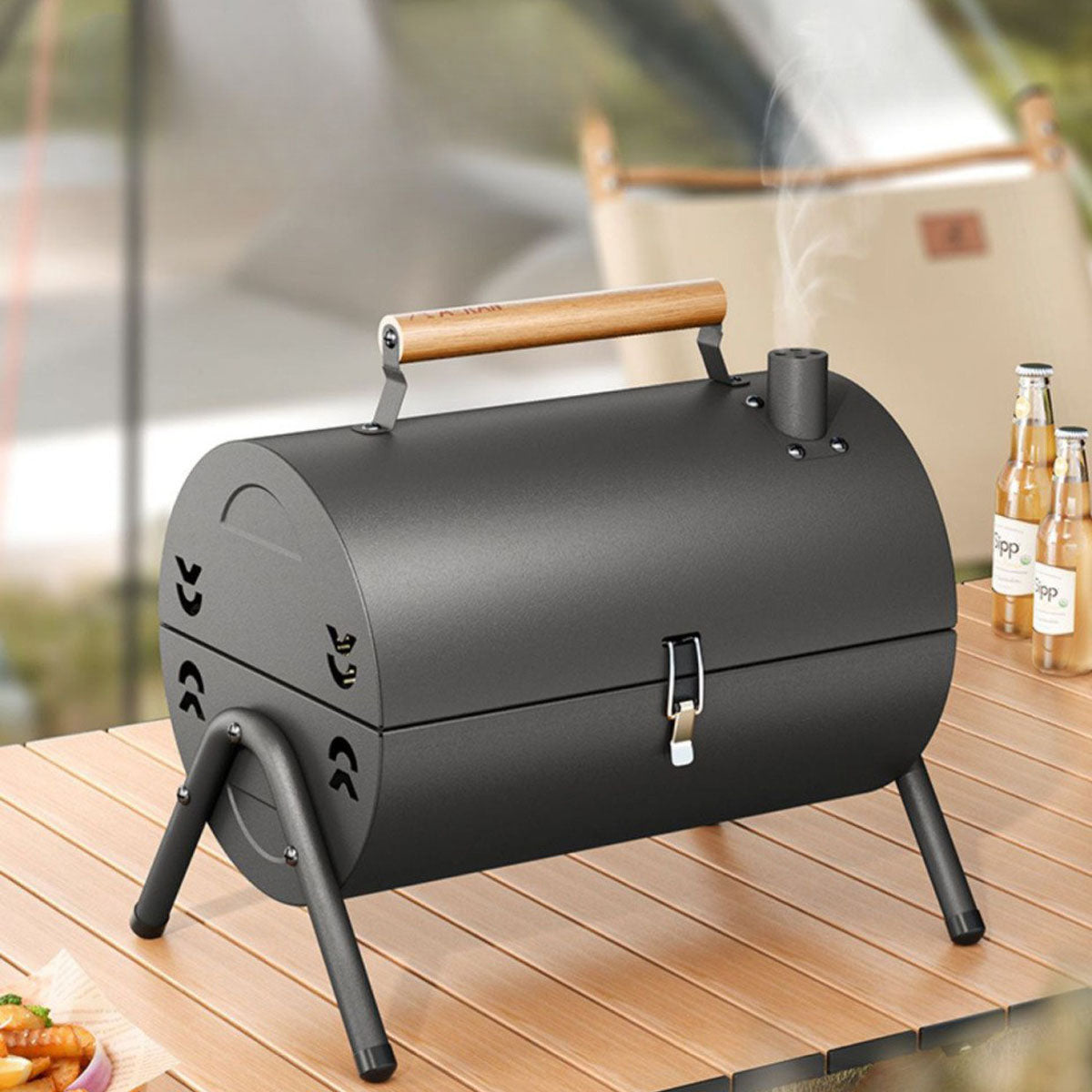 Small portable charcoal grill, excellent for outdoor cooking, camping, and picnics.