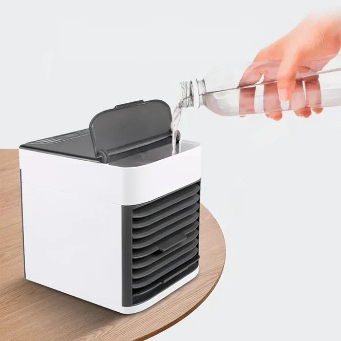 Personal evaporative air cooler for desktop use, a compact cooling solution for office & home.