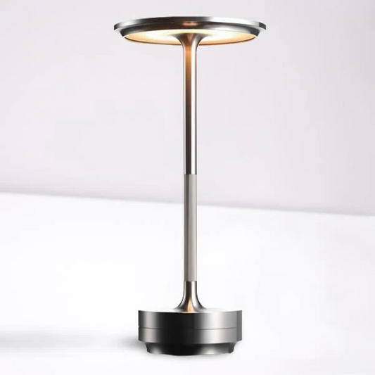 Portable cordless LED table lamp with adjustable light settings for modern home decor.