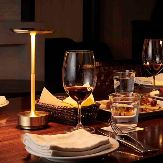 Portable cordless metal table lamp with adjustable brightness, modern design.