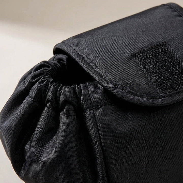 Compact women's cosmetic travel pouch with drawstring, ideal for portable makeup and beauty essentials.