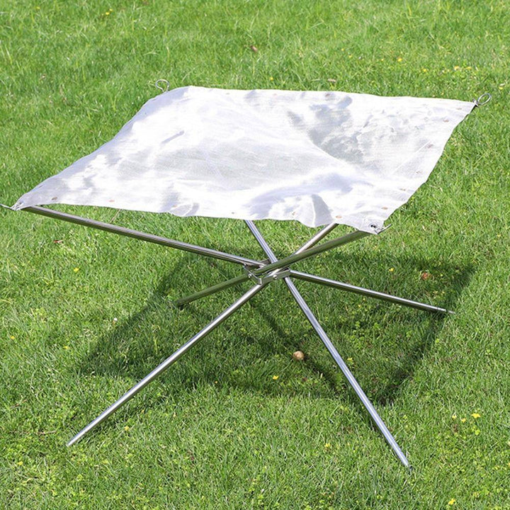 Compact camping fire pit rack for outdoor adventures, perfect for campfires & cooking, made from robust stainless steel.