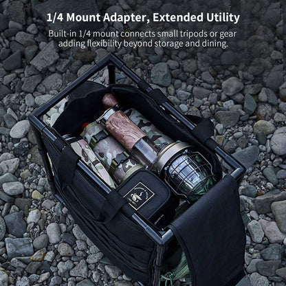 Hand carrying the folded aluminum camping table with its 30L storage bag, highlighting portability