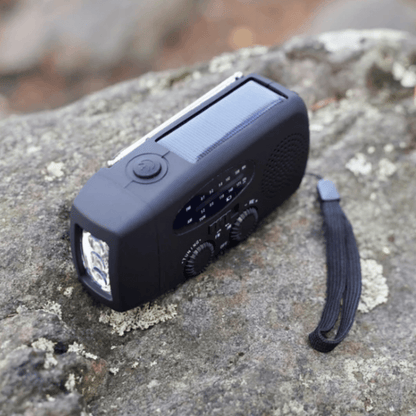 Portable hand crank emergency radio with flashlight and power bank for camping and survival