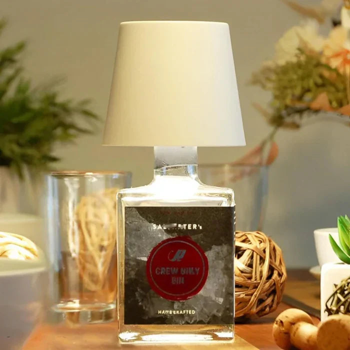Sleek portable GlowBottle LED table lamp with intuitive touch control and long-lasting battery.