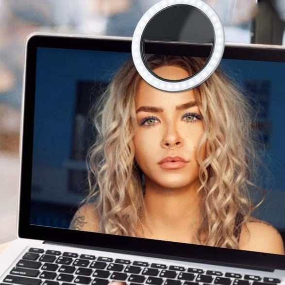 Universal USB rechargeable LED ring light for laptops, tablets, and smartphones. Dimmable brightness.