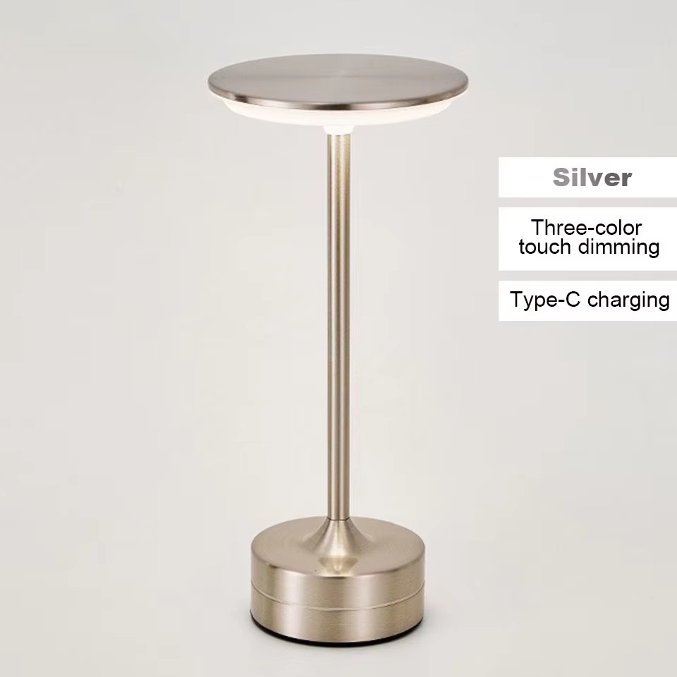 Gold rechargeable LED lamp, touch activated, ideal as a portable desk light.
