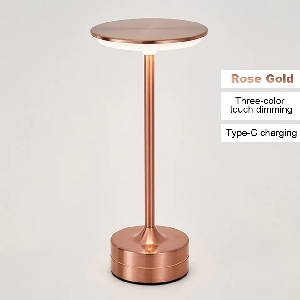 Rose gold LED bedside touch lamp, USB rechargeable, modern and portable.