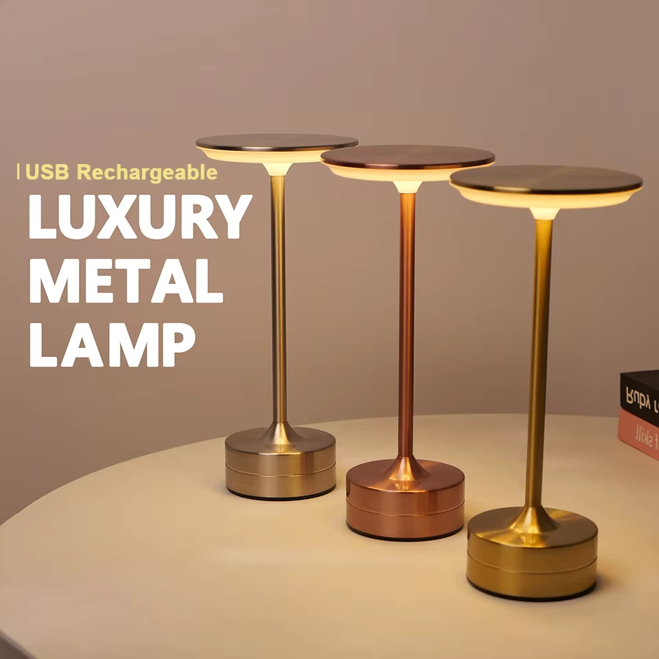 Gold portable LED lamp, touch sensor, USB rechargeable for desk or accent light.