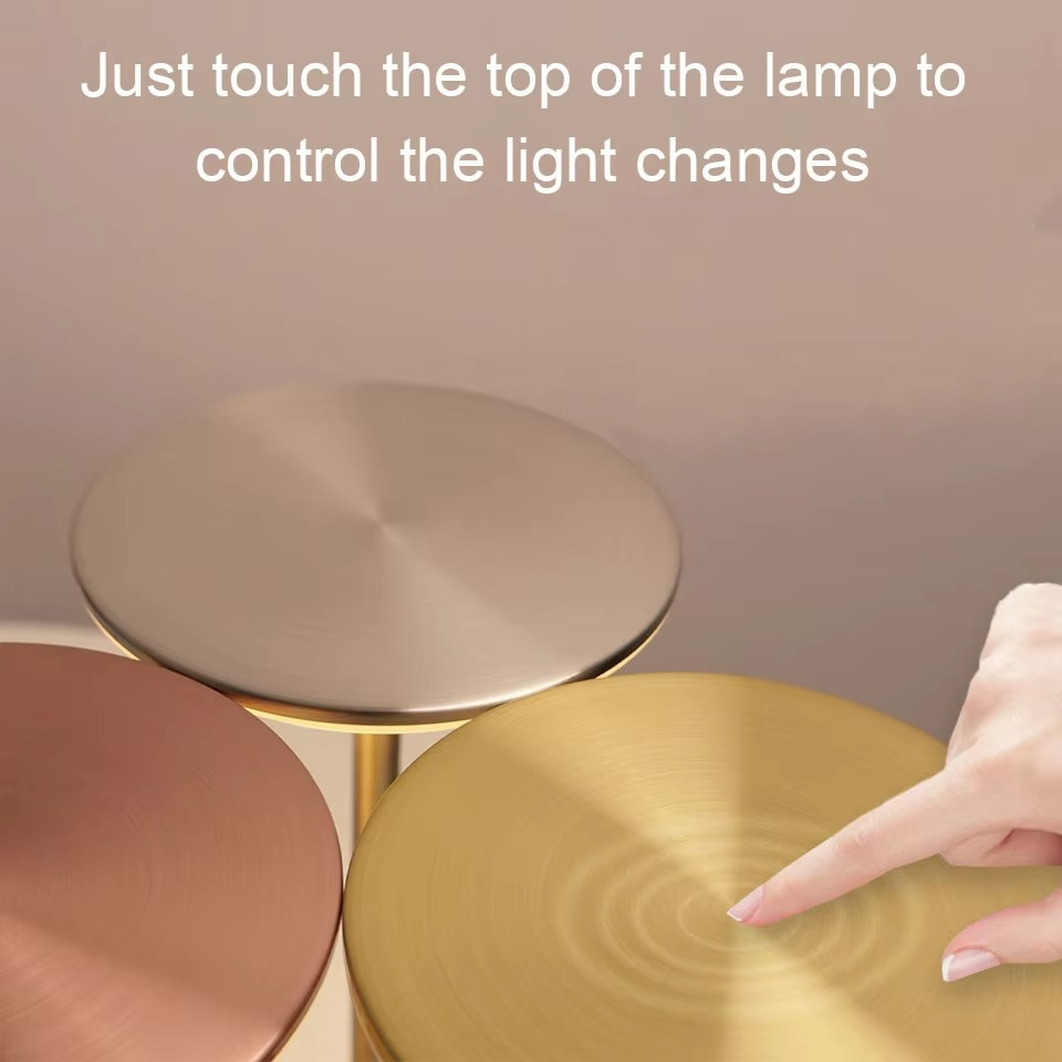 Compact silver LED touch lamp, cordless and portable, ideal for modern spaces.