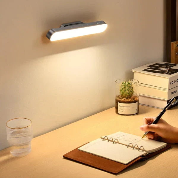 Portable magnetic LED desk lamp with touch control, ideal for workspace, rechargeable & eye-friendly.