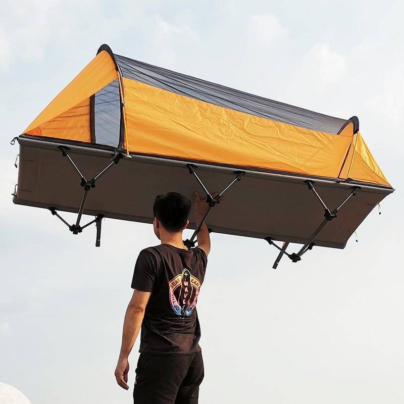 Lightweight yellow and green off-ground tent, perfect for backpacking and camping shelter.
