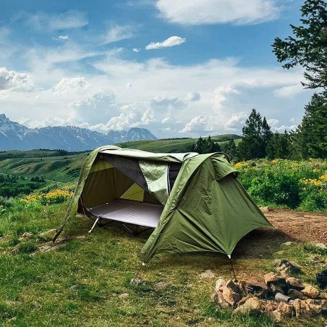 Off-ground camping tent: Portable yellow and green design, elevated for comfort during outdoor adventures.