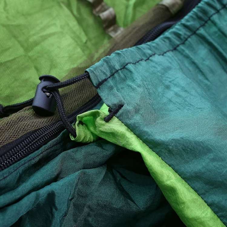 Robust outdoor relaxation hammock with mosquito netting, perfect for bug-free camping.