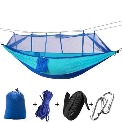 Secure camping hammock with integrated bug net, offering peaceful outdoor relaxation.