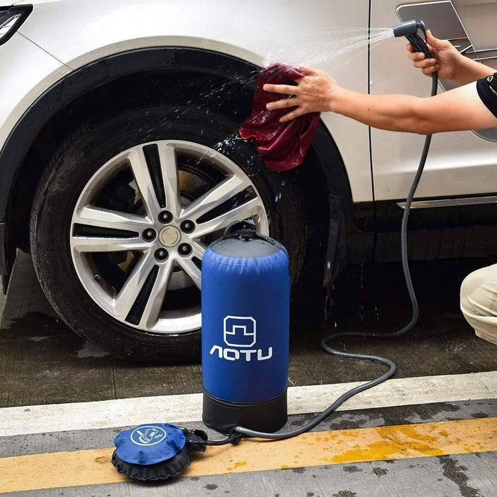 Compact portable outdoor pressure shower kit including blue water bag, hose & foot pump for travel