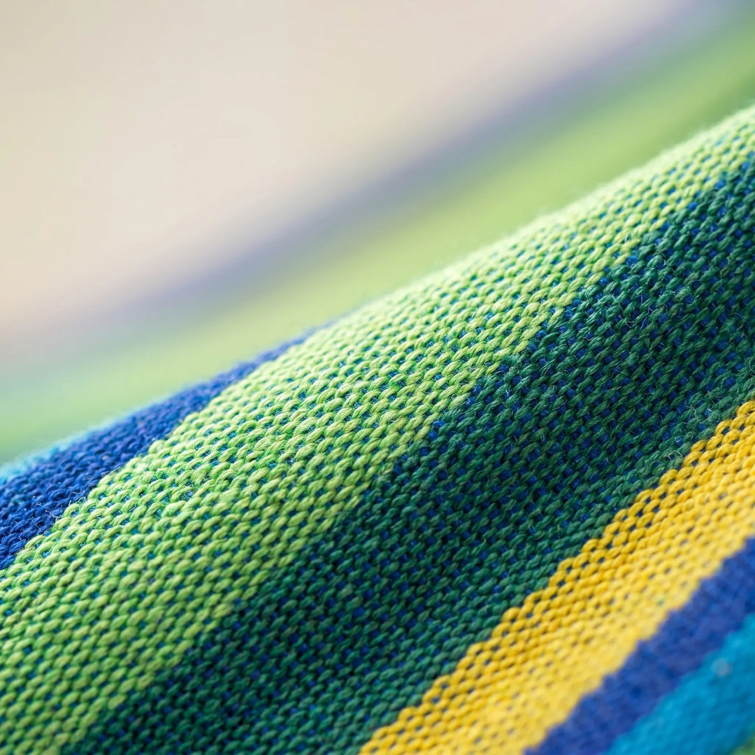 Comfortable striped portable hammock for garden, camping, or backyard. Enjoy outdoor relaxation anywhere.