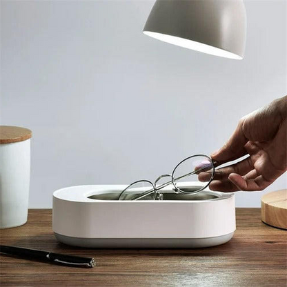 Portable ultrasonic cleaner for jewelry & eyeglasses, offering deep cleaning for watches, dental trays & makeup brushes.