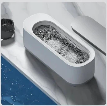 Household portable ultrasonic cleaner. Perfect for deep cleaning jewelry, watches, eyeglasses & makeup brushes.