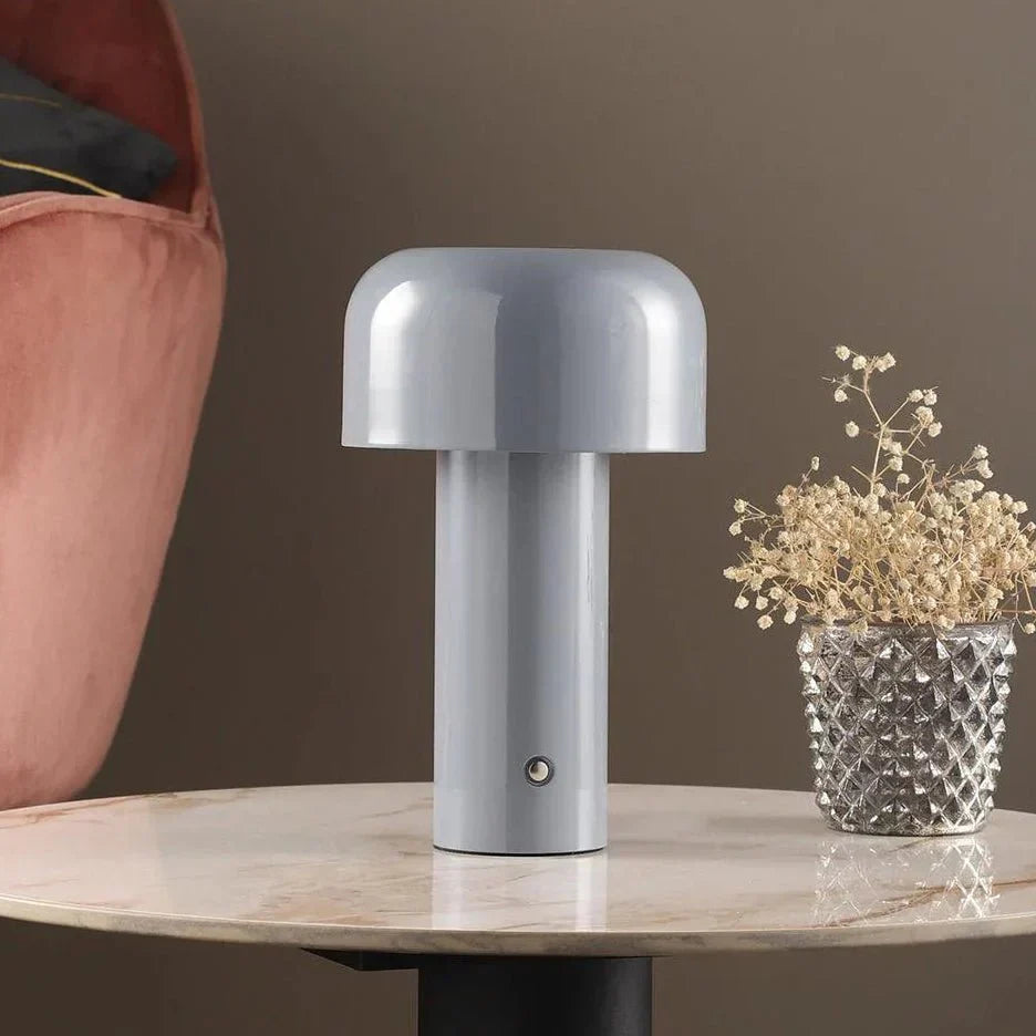 Rechargeable accent lamp providing modern, portable lighting for any room decor.