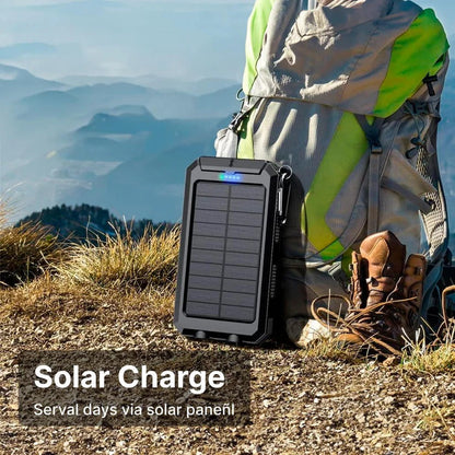 Solar power bank charging a smartphone outdoors, harnessing sun's energy for power.